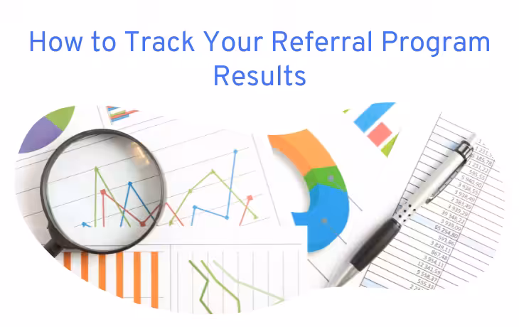 Graphs and charts with a magnifying glass and pen, representing the tracking of referral program results.