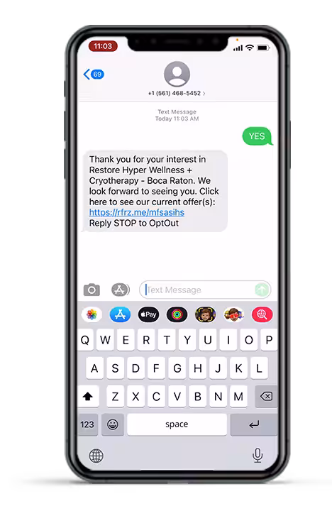 A text message on a phone thanks the recipient for their interest in Restore Hyper Wellness, linking to current offers.