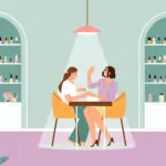 Manicurist painting client's nails in modern salon